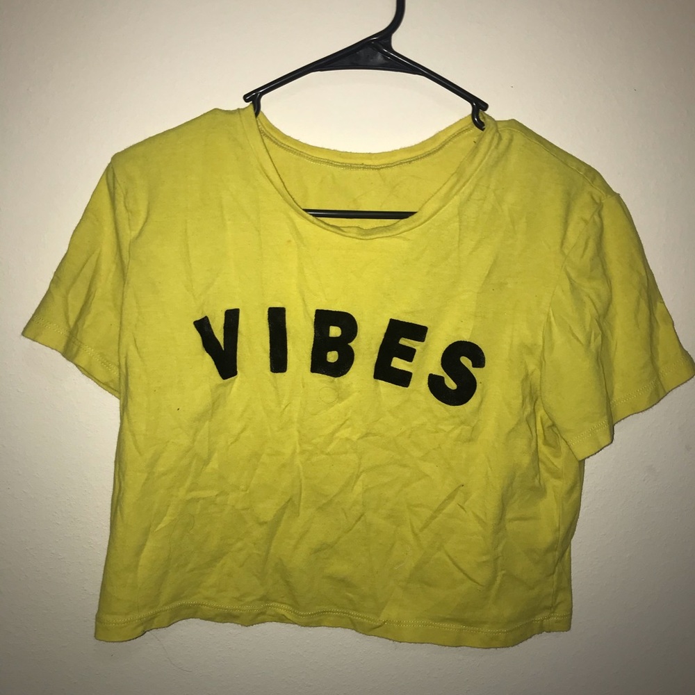 Yellow "Vibes" crop top.